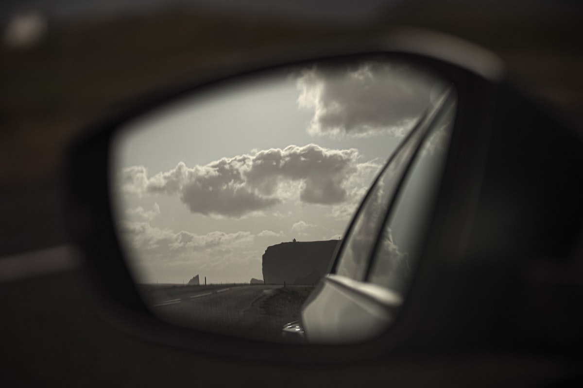 Cracked car side mirror glass before replacement